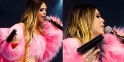 Cantora Melody segurando uma arma (Foto: Reprodução, Instagram)